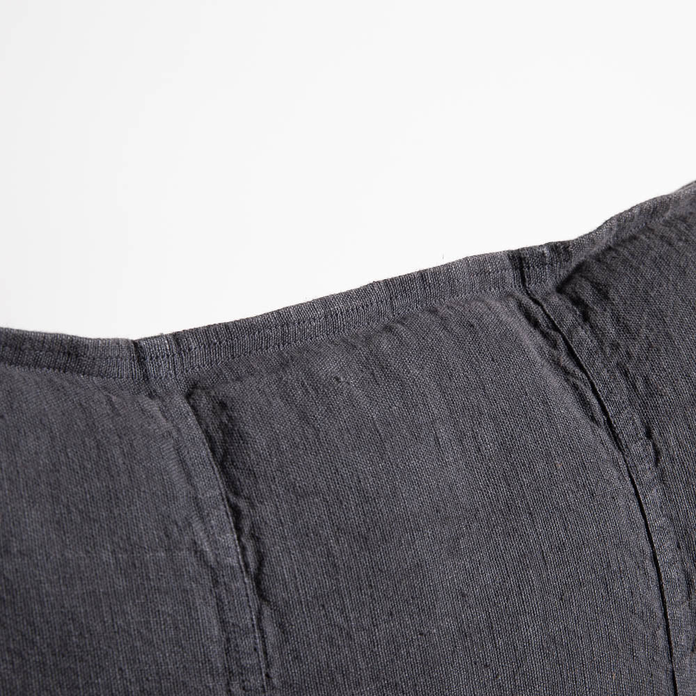 Close view of the Eadie Lifestyle Luca linen cushion in Midnight, showing the seamed panels.