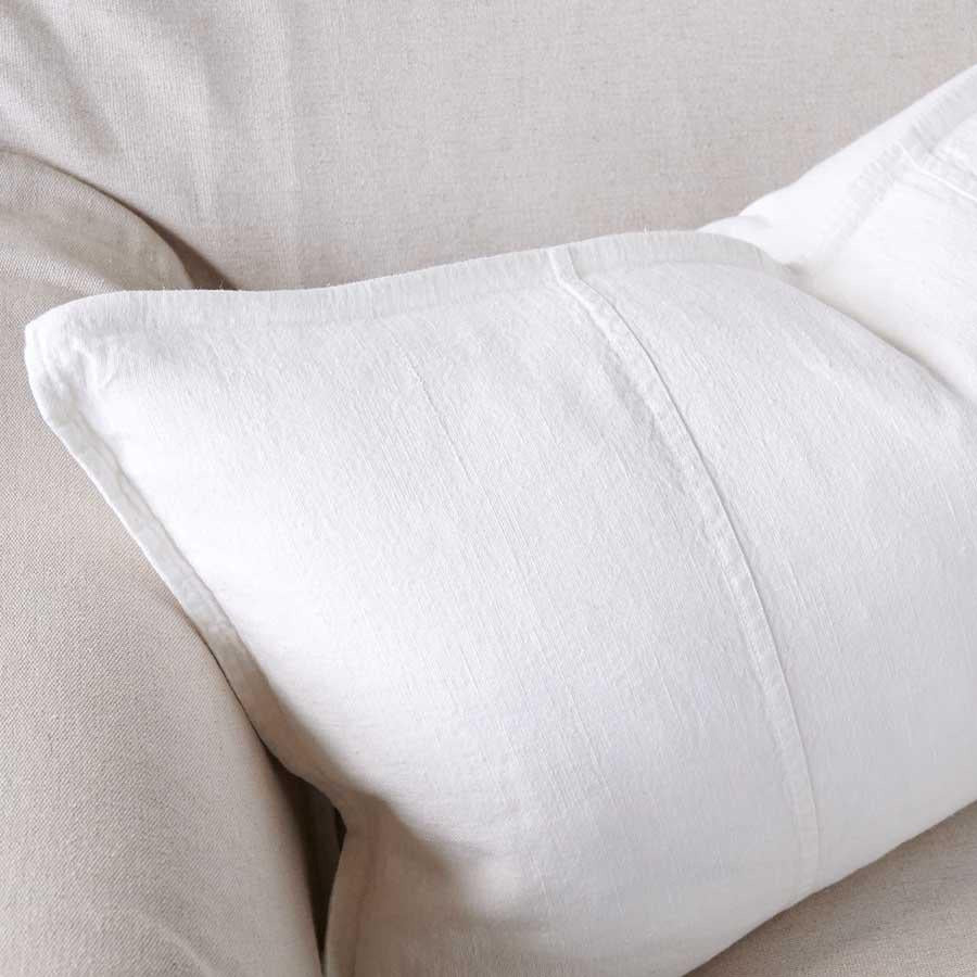 Close view of the stitched flange on the Luca linen cushion in Off White.