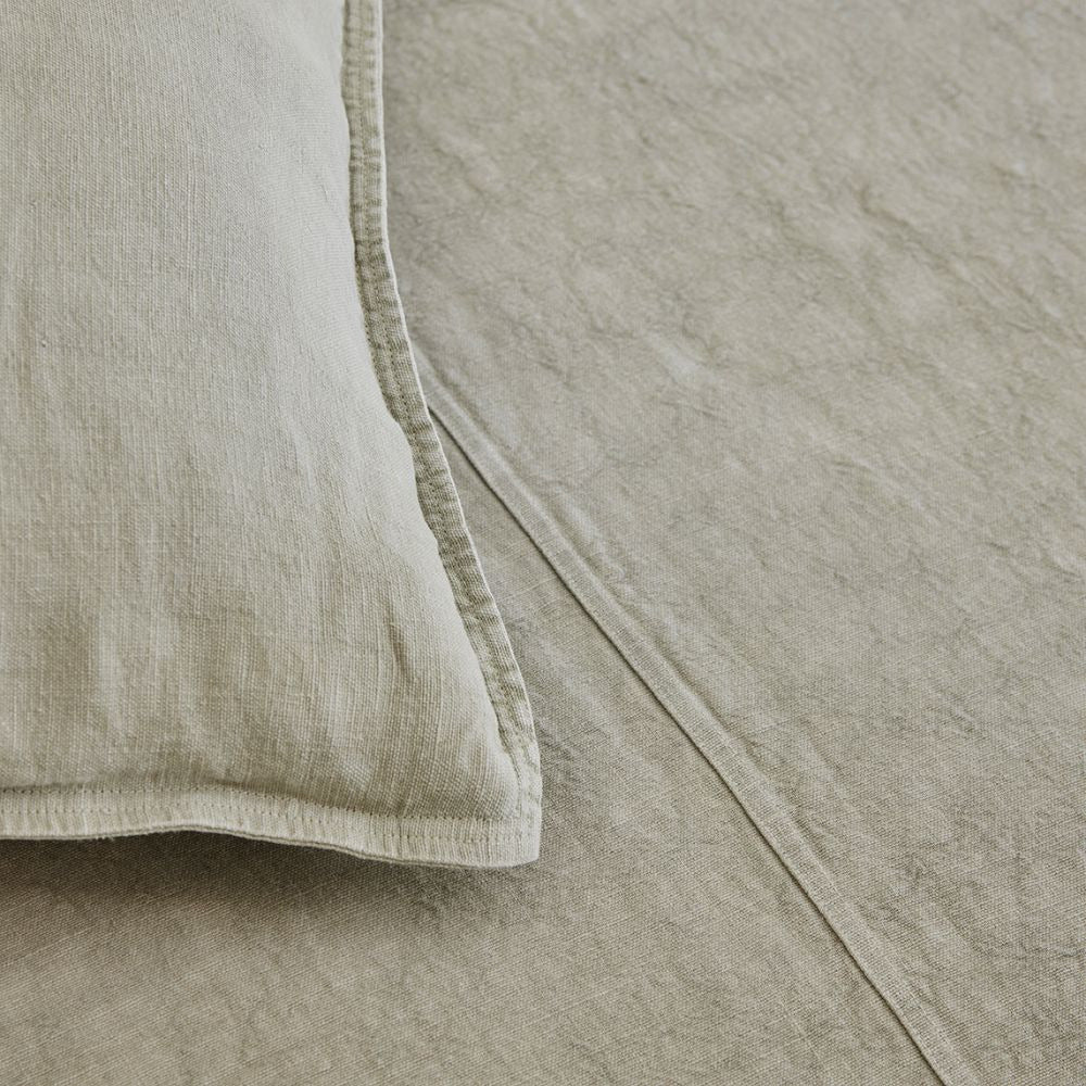 Close view of the Eadie Lifestyle Luca linen cushion in Putty at the stitched edge.