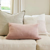 Eadie Lifestyle Luca linen cushion in Putty behind a blush lumbar cushion on a linen sofa.
