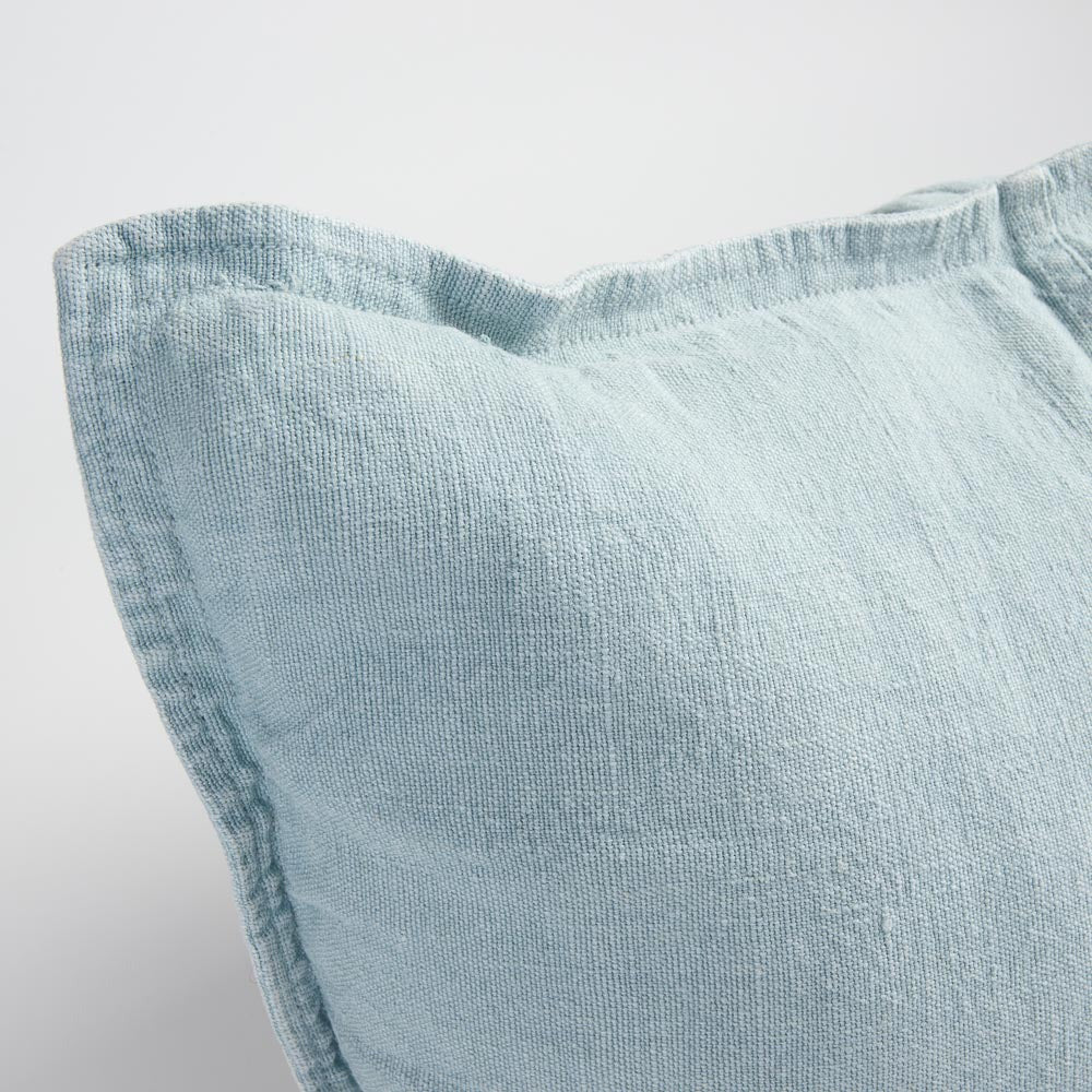 Close view of the Eadie Lifestyle Luca linen cushion in Sky at the corner and edge.