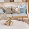 Eadie Lifestyle Luca linen cushions in Sky on a pale sofa with neutral cushions.