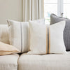 Eadie Lifestyle Luca linen cushion in Soft Butter beside striped linen cushions.
