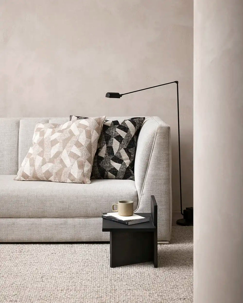 The Baya abstract patterned cushions 'Oscari' on a couch in a contemporary living room