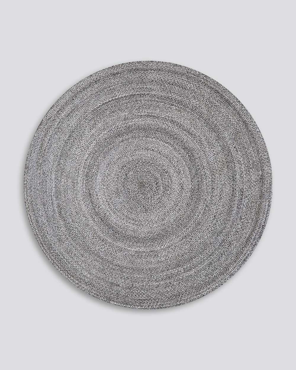 Full view of Baya NZ's round outdoor rug in cool-grey tones. 
