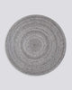 Full view of Baya NZ's round outdoor rug in cool-grey tones. 