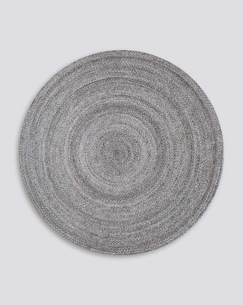 Full view of Baya NZ's round outdoor rug in cool-grey tones. 