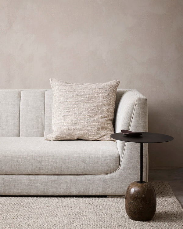 Baya textural cushion in neutral creamy beige/ecru  colour, on a modern couch in a stylish nz living room