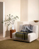 Baya nz wool throw plaid throw blanket in grey, charcoal and green, draped over a modern chair