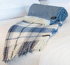 Palliser Ridge Herringbone throw in Royal Blue rolled to show the weave texture, styled on a bed