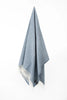 Palliser Ridge Herringbone throw in Royal Blue hanging in full drape, showing the fringed edge