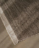 Weave Home Anton wool rug in Ash, close view of the cut and loop pile and cream cotton fringe