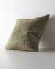 Weave Home Castel cushion in Moss, shown from an angle on a plain background.