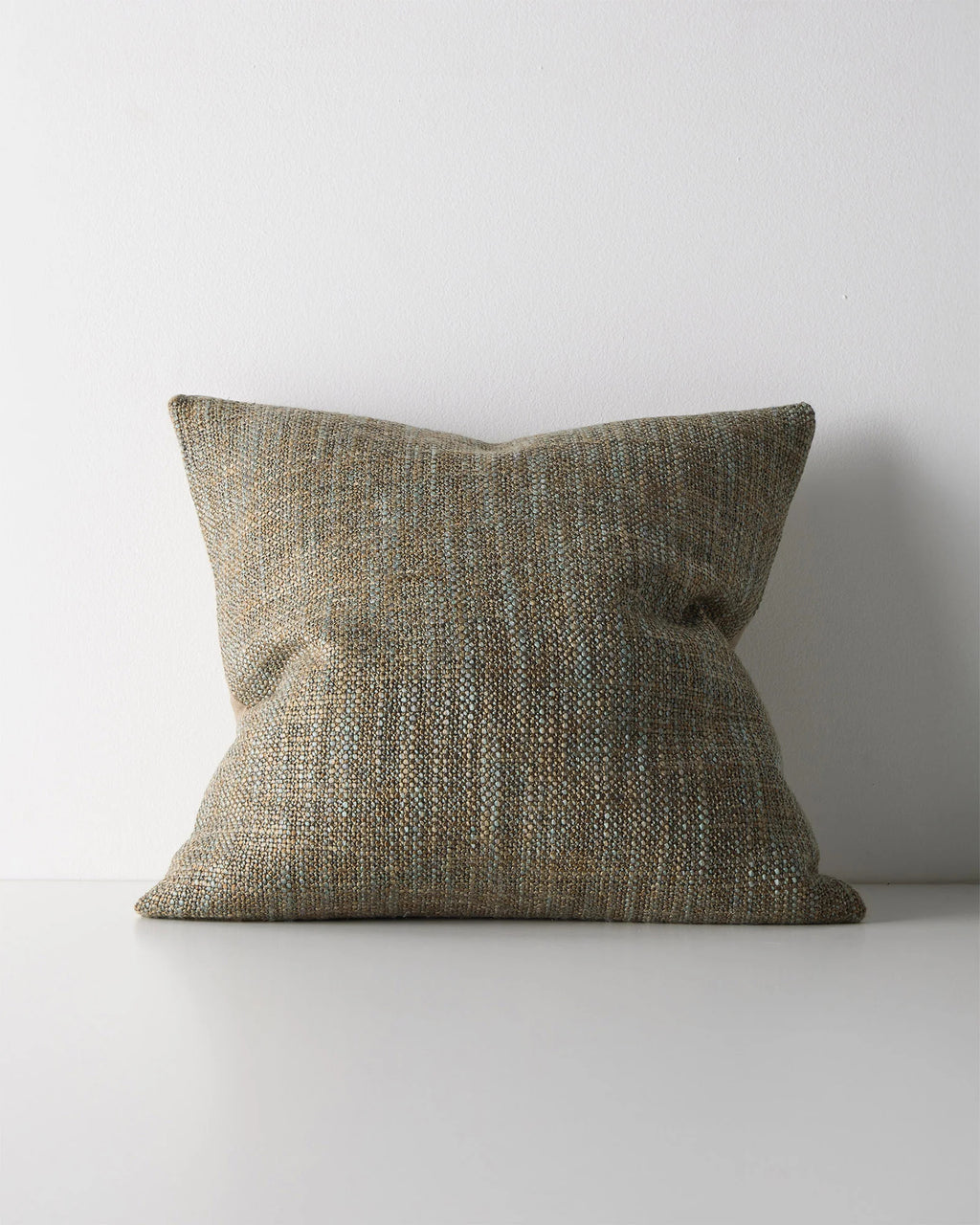 Weave Home Castel cushion in Tide on a plain background.