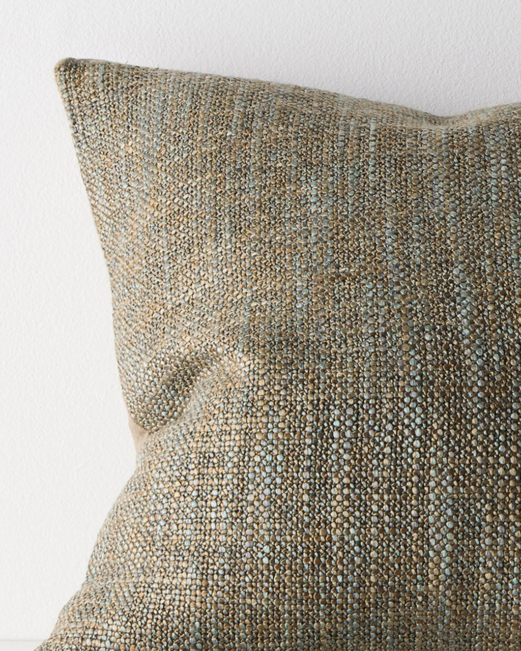 Close-up of the woven texture on the Weave Home Castel cushion in Tide.