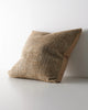 Weave Home Castel cushion in Toffee, shown from an angle on a plain background.