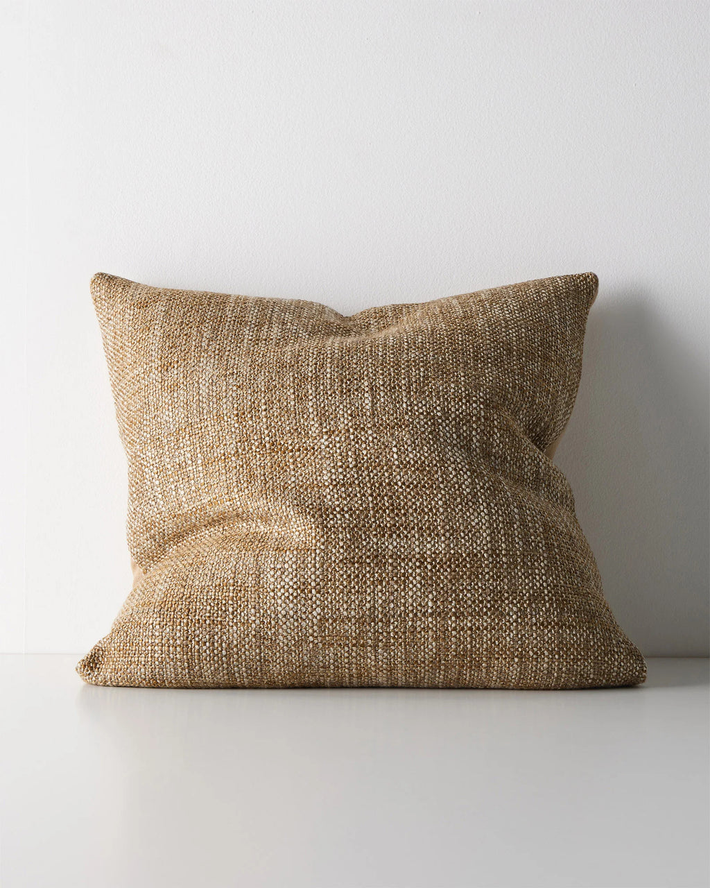 Weave Home Castel cushion in Toffee on a plain background.