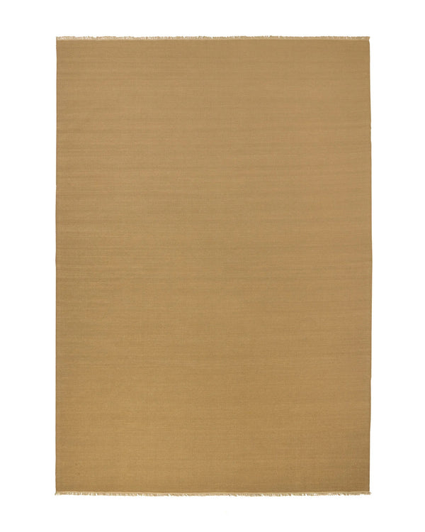 Weave Home Jacqueline wool rug in Brulee, full flatweave rug with fringed edges on a plain background.