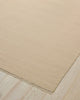 Weave Home Jacqueline wool rug in Cashew on a pale timber floor, showing the fringed corner