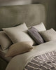 A selection  of green toned Weave Home bedroom decor