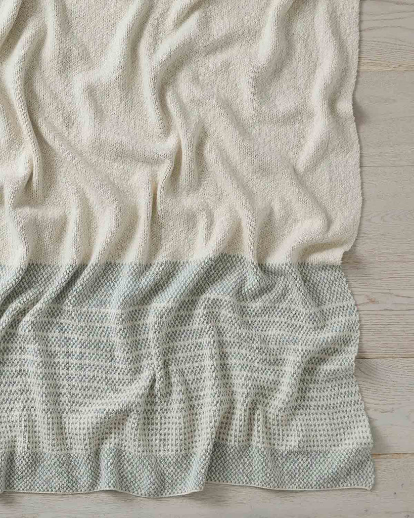 A full image of the Sonoma throw blanket in shade Laurel, by Weave Home. 