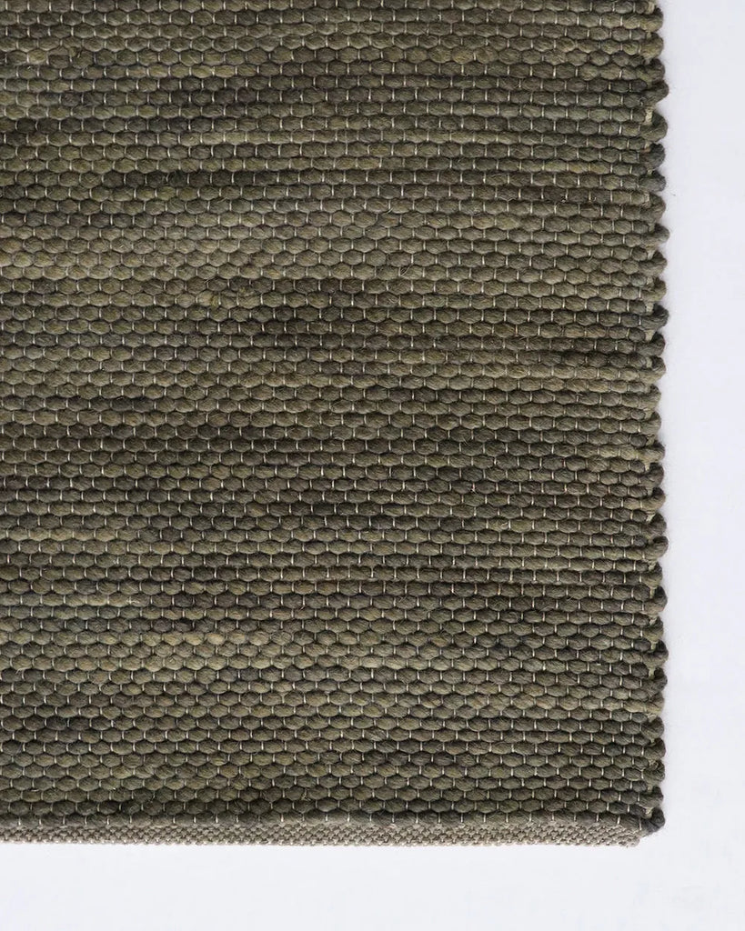 Close up Baya khaki green 'Boardwalk' wool blend floor rug